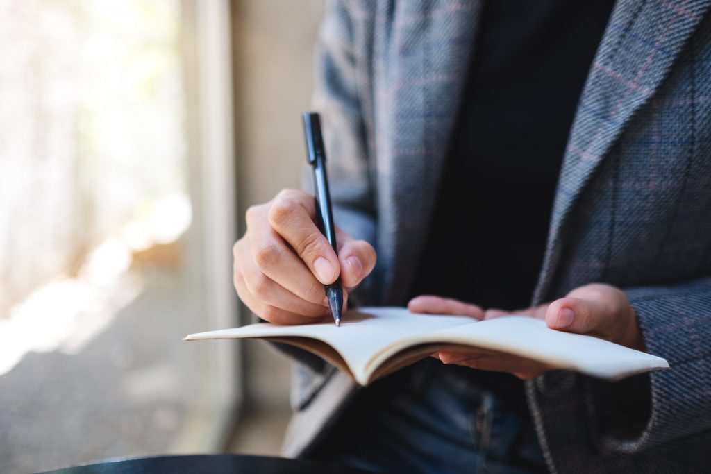 notebook man writing