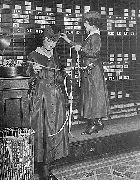 women sorting computer information